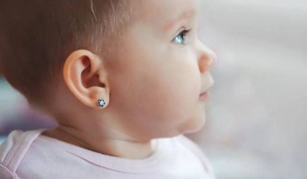 Best age to pierce baby ears with a parent caring for a baby